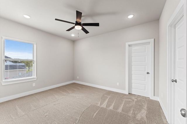 carpeted spare room with baseboards, ceiling fan, and recessed lighting