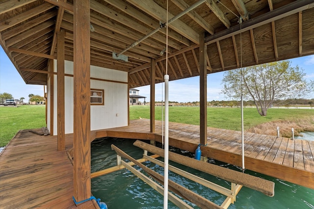 dock area featuring a lawn