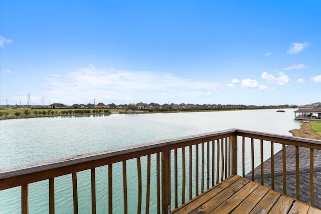 wooden deck with a water view