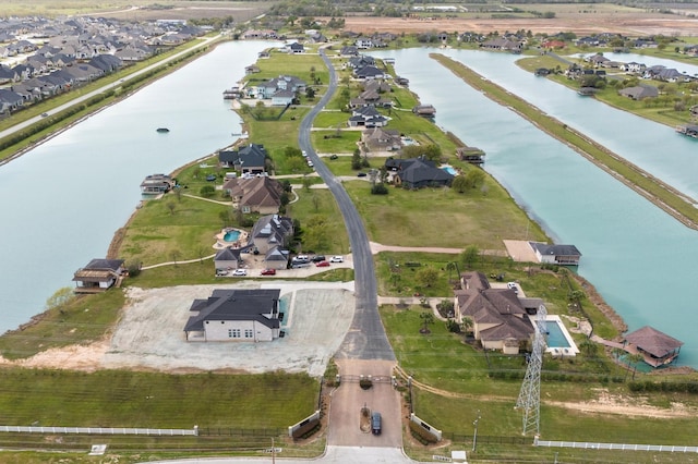 birds eye view of property with a residential view and a water view