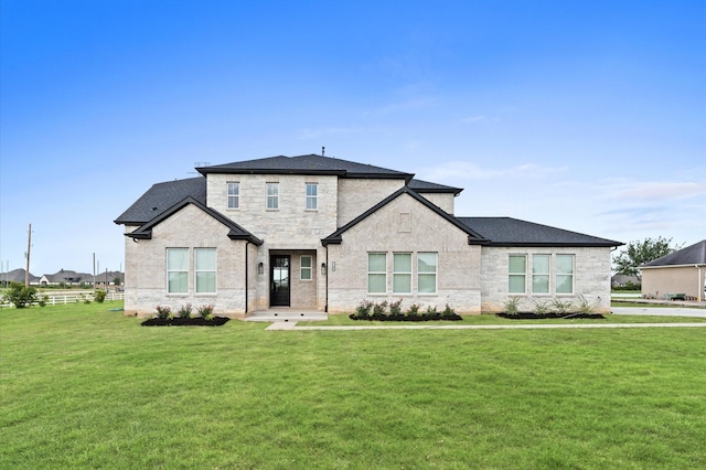 27003 Skiers Crossing Dr, Katy, TX 77493 - view of front facade featuring a front yard, a shingled roof, and stone siding