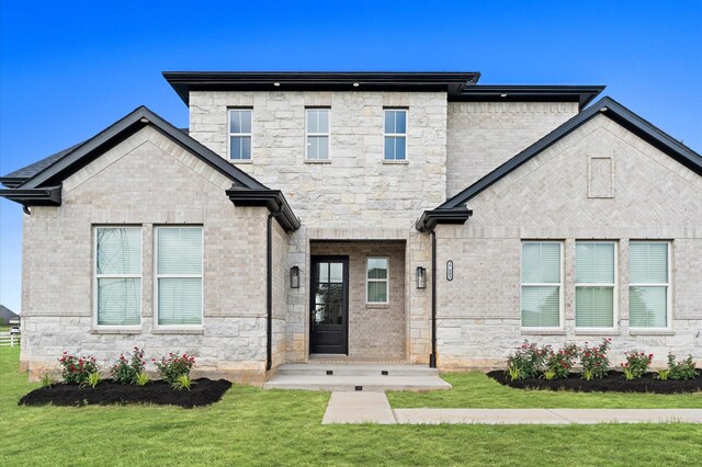 27003 Skiers Crossing Dr, Katy, TX 77493 - view of front of home with a front lawn and stone siding