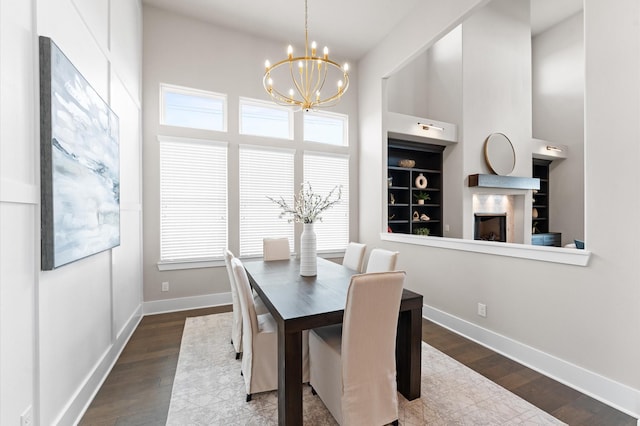27003 Skiers Crossing Dr, Katy, TX 77493 - dining space featuring a chandelier, wood finished floors, plenty of natural light, and a towering ceiling