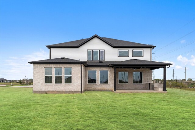 27003 Skiers Crossing Dr, Katy, TX 77493 - rear view of property with a patio and a lawn