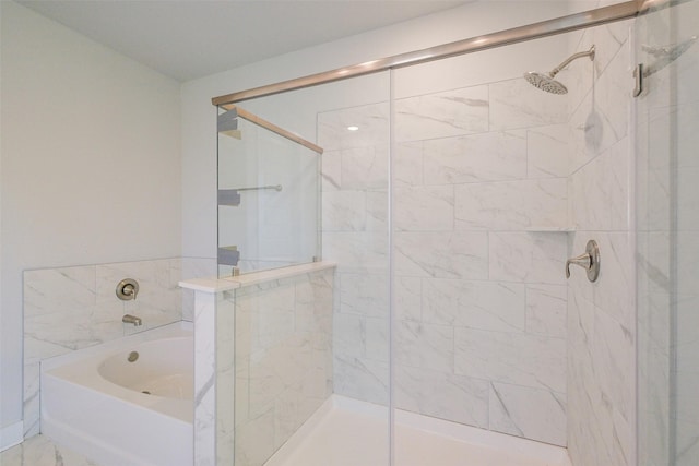 full bath with a bath and a stall shower