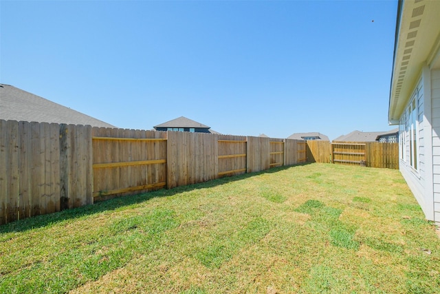 view of yard featuring a fenced backyard