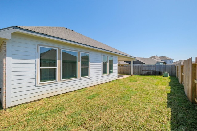 exterior space featuring a yard and a fenced backyard