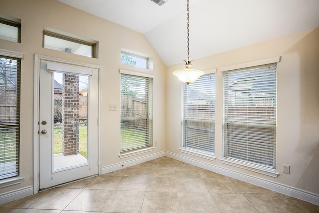 155 Forest Heights Ln, Montgomery, TX 77316 - unfurnished dining area featuring light tile patterned floors, baseboards, lofted ceiling, and visible vents