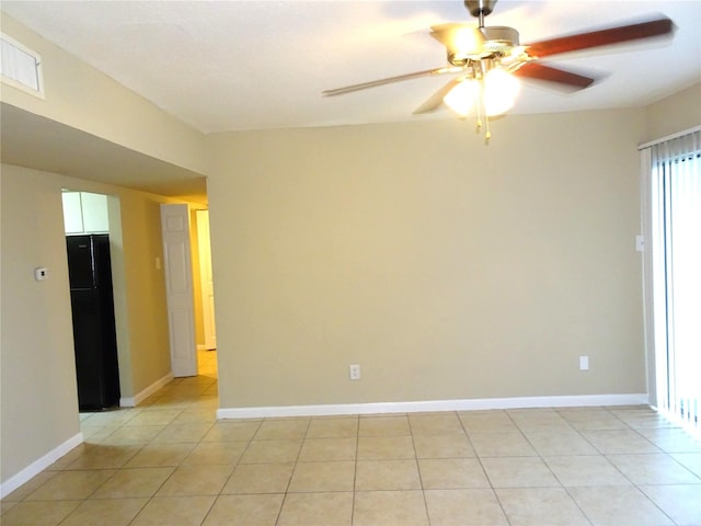 unfurnished room featuring visible vents, baseboards, ceiling fan, and light tile patterned flooring