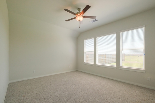 spare room with visible vents, ceiling fan, carpet floors, and baseboards