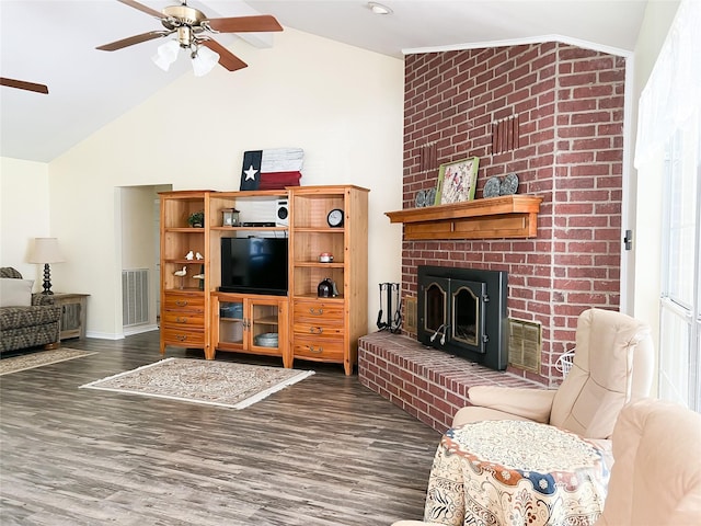 518 Lcr 902, Jewett, TX 75846 - living area with visible vents, lofted ceiling, a ceiling fan, wood finished floors, and a brick fireplace