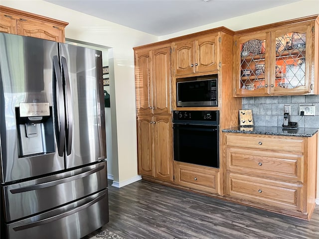 518 Lcr 902, Jewett, TX 75846 - kitchen with dark stone countertops, built in microwave, dark wood finished floors, stainless steel refrigerator with ice dispenser, and black oven