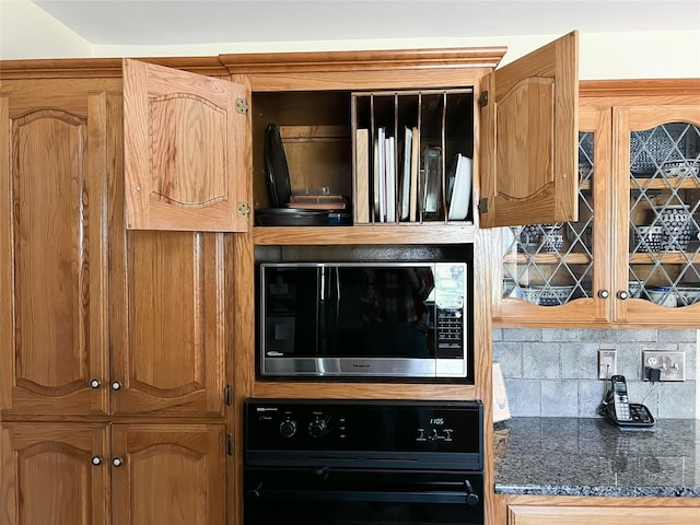 518 Lcr 902, Jewett, TX 75846 - room details featuring brown cabinets, wall oven, stainless steel microwave, and tasteful backsplash