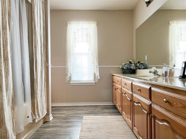 518 Lcr 902, Jewett, TX 75846 - full bathroom with baseboards, wood finished floors, vanity, and a shower with curtain