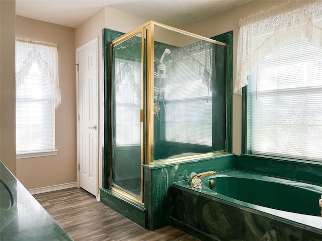 518 Lcr 902, Jewett, TX 75846 - full bathroom featuring a bath, a shower stall, baseboards, and wood finished floors