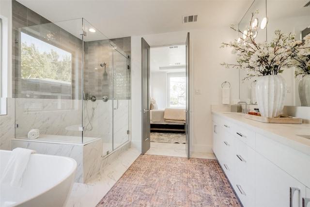 1609 Park St, Houston, TX 77019 - ensuite bathroom with a marble finish shower, a freestanding bath, double vanity, marble finish flooring, and recessed lighting