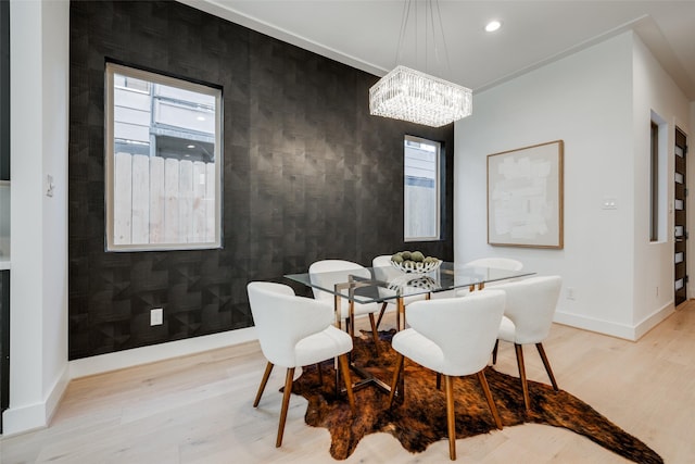 1609 Park St, Houston, TX 77019 - dining room with light wood-type flooring, a chandelier, an accent wall, baseboards, and recessed lighting