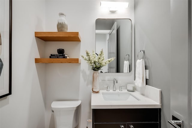 1609 Park St, Houston, TX 77019 - half bathroom featuring vanity and toilet