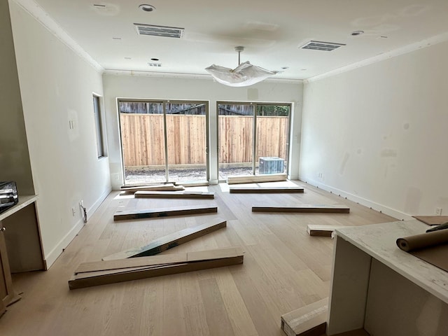 1609 Park St, Houston, TX 77019 - spare room featuring wood finished floors, crown molding, and baseboards