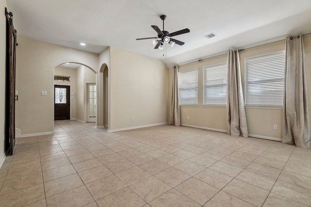 19214 S Cottonwood Green Ln, Cypress, TX 77433 - spare room featuring arched walkways, ceiling fan, light tile patterned floors, recessed lighting, and baseboards