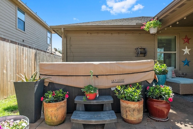 view of patio featuring fence