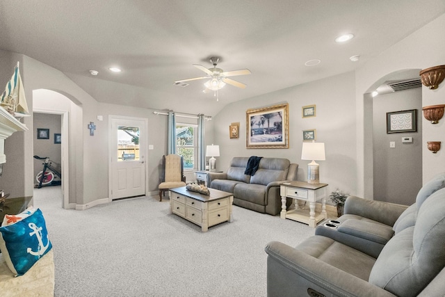 living room with light carpet, recessed lighting, arched walkways, lofted ceiling, and ceiling fan