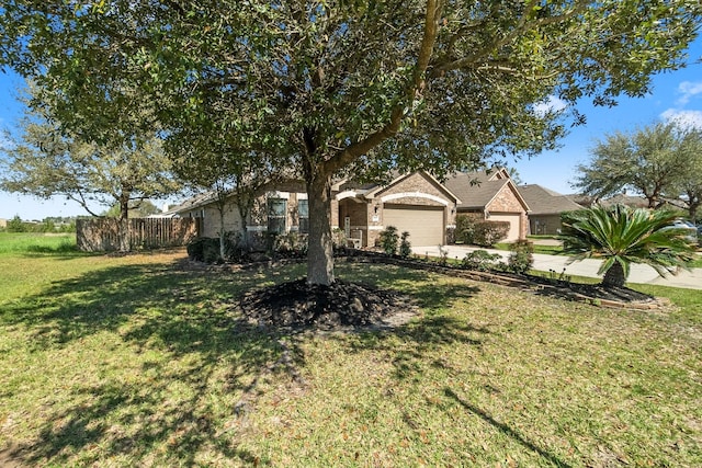 ranch-style home featuring driveway, a front lawn, an attached garage, and fence