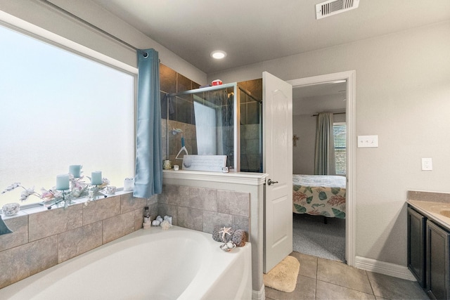 ensuite bathroom featuring visible vents, a stall shower, a bath, tile patterned floors, and ensuite bath