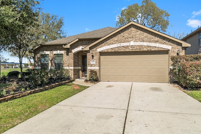 view of front of home with brick siding, concrete driveway, an attached garage, and a shingled roof