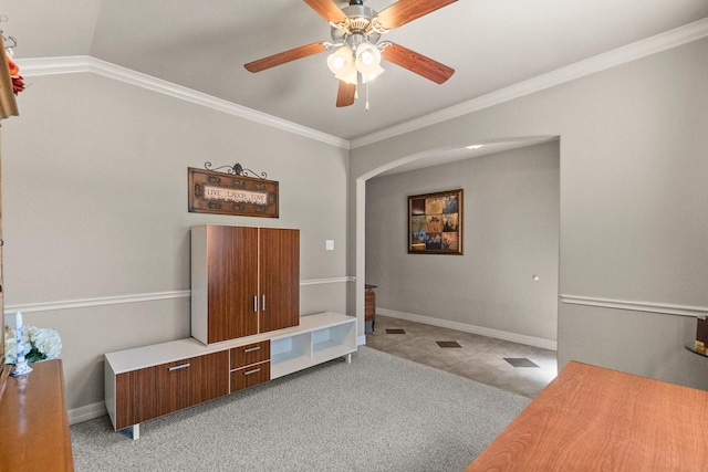 bedroom with baseboards, arched walkways, light colored carpet, and crown molding