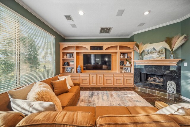 18719 Rusty Anchor Ct, Humble, TX 77346 - living area with crown molding, recessed lighting, visible vents, and a tile fireplace
