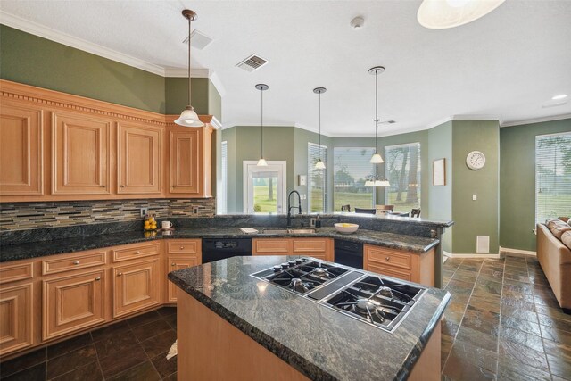 18719 Rusty Anchor Ct, Humble, TX 77346 - kitchen featuring visible vents, a sink, backsplash, stone tile floors, and stainless steel gas stovetop