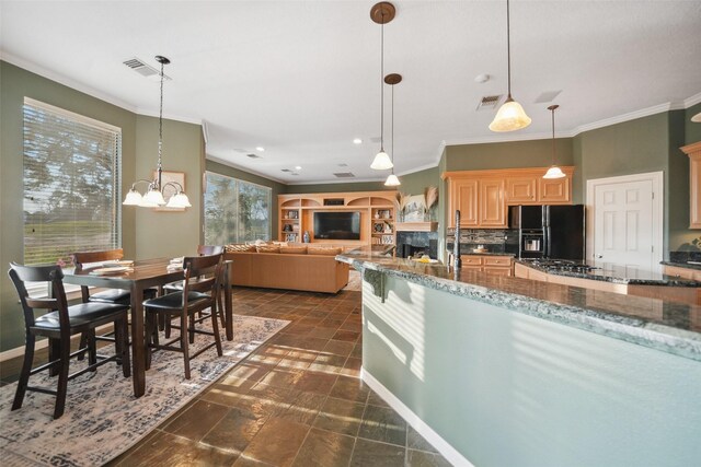 18719 Rusty Anchor Ct, Humble, TX 77346 - kitchen featuring visible vents, black appliances, decorative backsplash, and crown molding