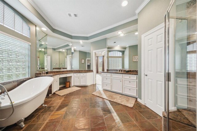 18719 Rusty Anchor Ct, Humble, TX 77346 - full bathroom with crown molding, a freestanding tub, and a healthy amount of sunlight