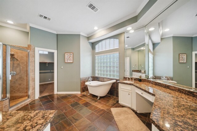 18719 Rusty Anchor Ct, Humble, TX 77346 - bathroom with visible vents, a stall shower, a freestanding bath, and vanity