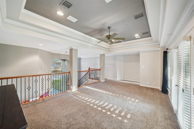 18719 Rusty Anchor Ct, Humble, TX 77346 - spare room featuring decorative columns, a raised ceiling, visible vents, and carpet flooring