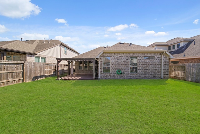 back of property featuring a patio, brick siding, a lawn, and a pergola