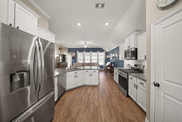 kitchen featuring a ceiling fan, visible vents, a peninsula, appliances with stainless steel finishes, and open floor plan