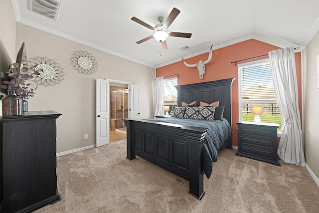 bedroom with visible vents, light colored carpet, baseboards, and vaulted ceiling