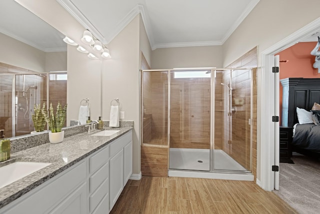 ensuite bathroom with a sink, connected bathroom, plenty of natural light, and a shower stall