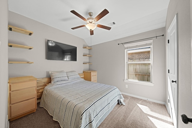 bedroom with a ceiling fan, visible vents, carpet floors, baseboards, and lofted ceiling