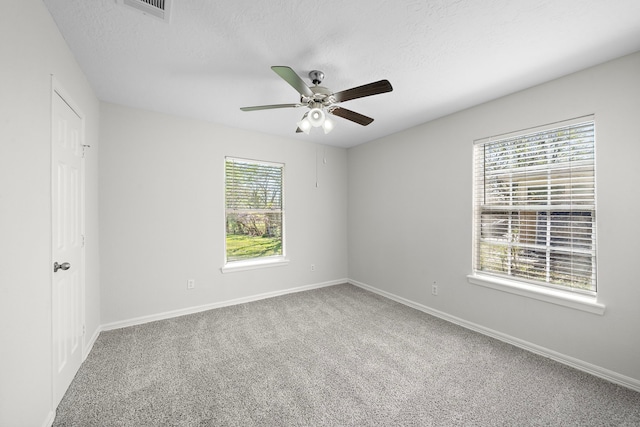 8355 Glencrest St, Houston, TX 77061 - unfurnished bedroom with carpet, a textured ceiling, and a ceiling fan