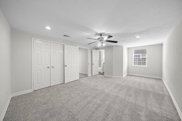 8355 Glencrest St, Houston, TX 77061 - unfurnished bedroom featuring carpet floors, recessed lighting, ceiling fan, a closet, and a textured ceiling