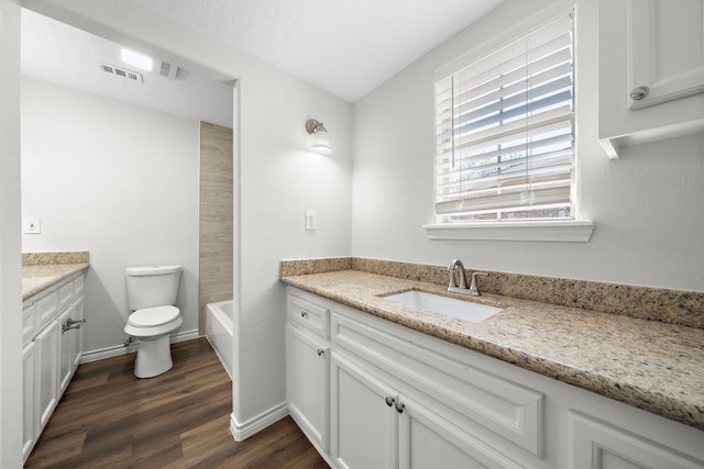 8355 Glencrest St, Houston, TX 77061 - bathroom with vanity, wood finished floors, and a bathtub
