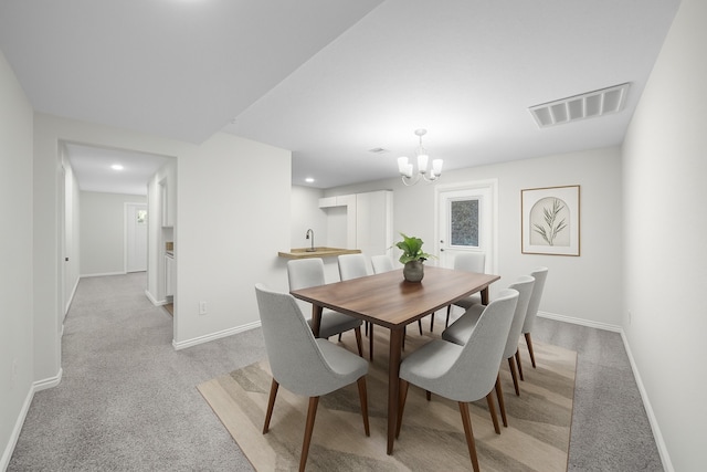 8355 Glencrest St, Houston, TX 77061 - dining space featuring light carpet, a chandelier, and recessed lighting