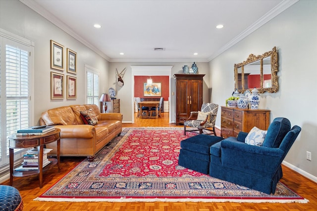 living area featuring crown molding, recessed lighting, and baseboards