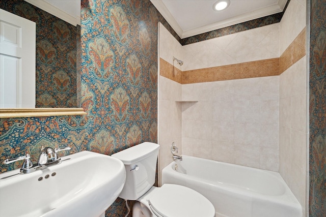 full bathroom with wallpapered walls, crown molding, toilet, and a sink