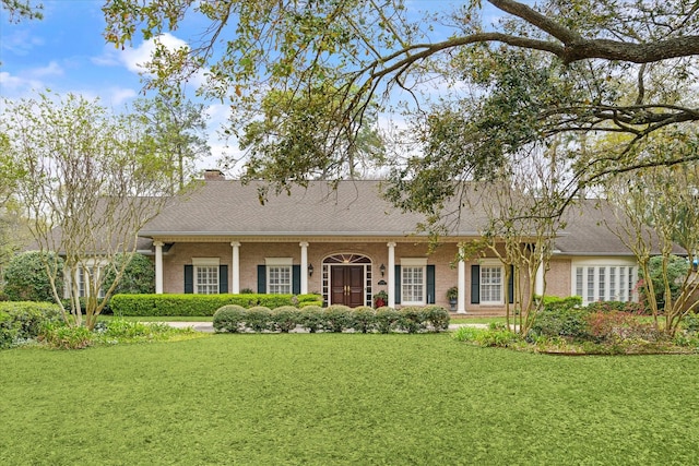 view of front of home with a front yard