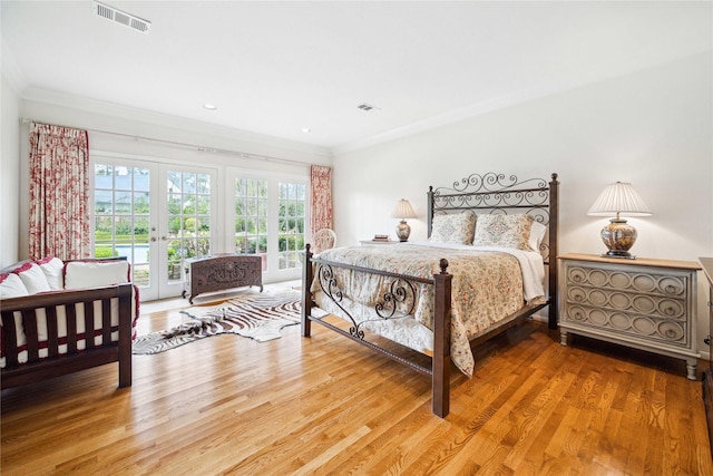 bedroom with access to outside, french doors, visible vents, and ornamental molding