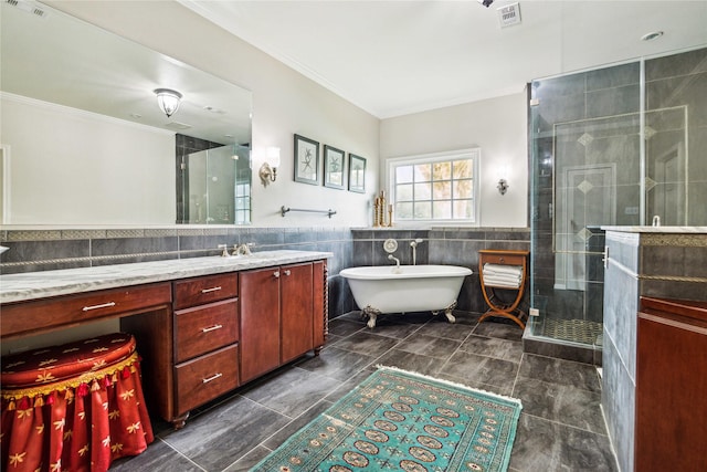 full bath with vanity, visible vents, ornamental molding, a shower stall, and tile walls